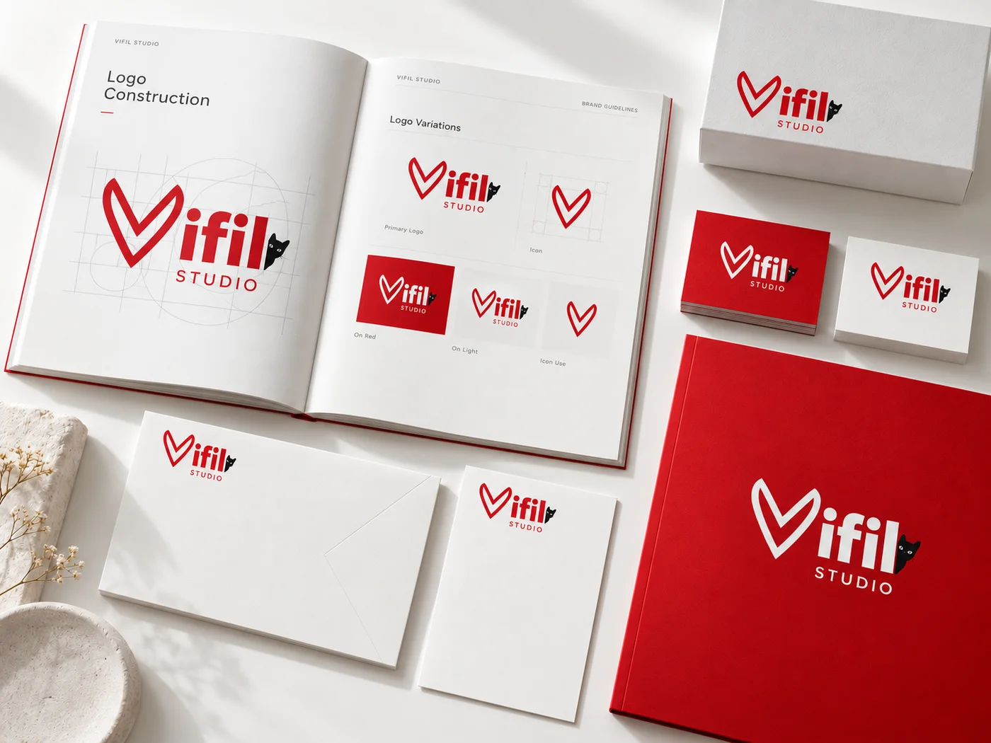 Composición conceptual de manual de marca, aplicaciones gráficas y papelería VIFIL